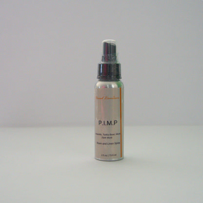 A 2.5 oz P.I.M.P  room & linen spray sitting against a white background made by Eternel Luminen. 