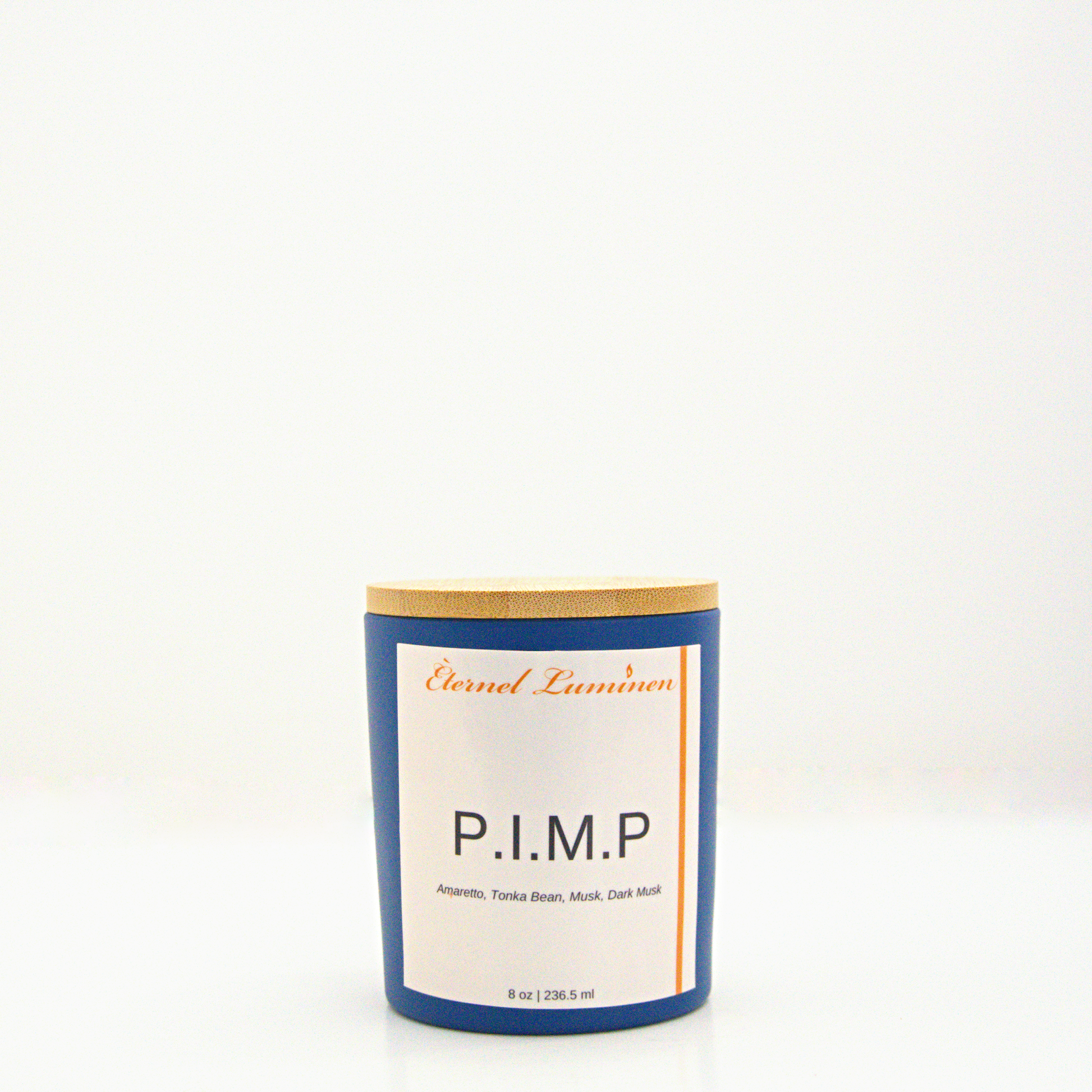 A 8 oz P.I.M.P frosted candle with a wooden lid sitting against a white background