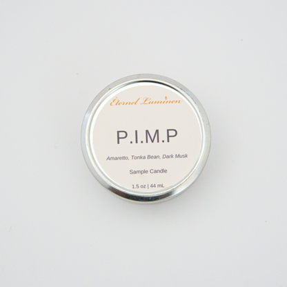 A 1.5oz P.I.M.P sample candle in a tin jar sitting against a white background 