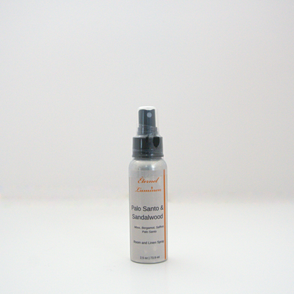 A 2.5oz Palo Santo & Sandalwood room & linen spray sitting against a white background made by Eternel Luminen. 