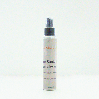 A 4 oz Palo Santo &Sandalwood room & linen spray sitting against a white background made by Eternel Luminen.