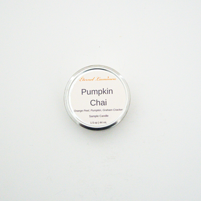 A 1.5oz Pumpkin Chai sample candle in a tin jar sitting against a white background made by Eternel Luminen