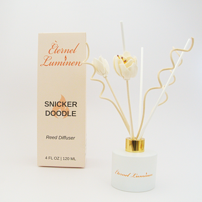 A 4oz Snickerdoodle reed diffuser in a frosted white jar sitting against a white background