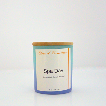 A 8oz spa day frosted candle with a wooden lid sitting against a white background made by Eternel Luminen.