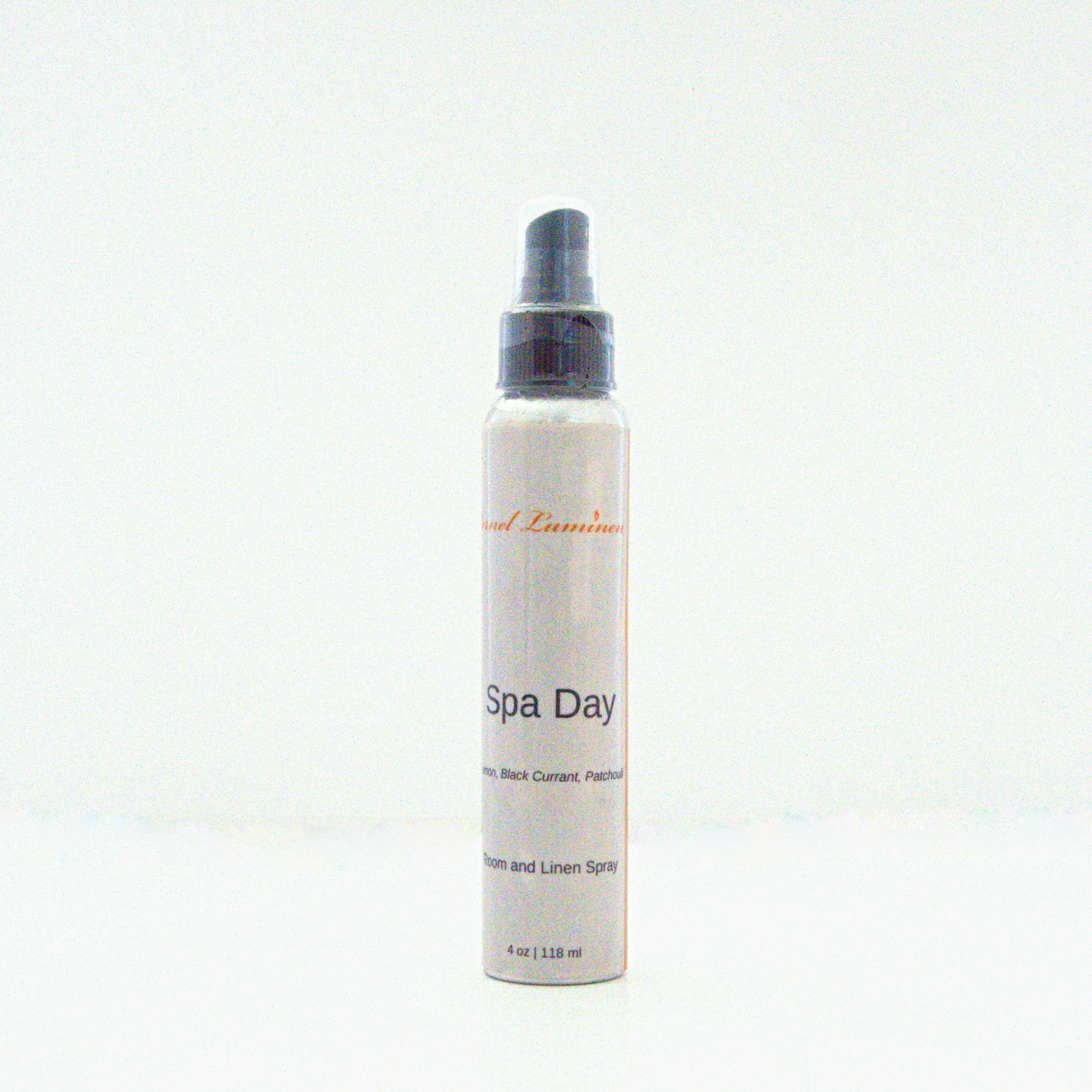 A 4 oz Spa Day room & linen spray sitting against a white background made by Eternel Luminen.