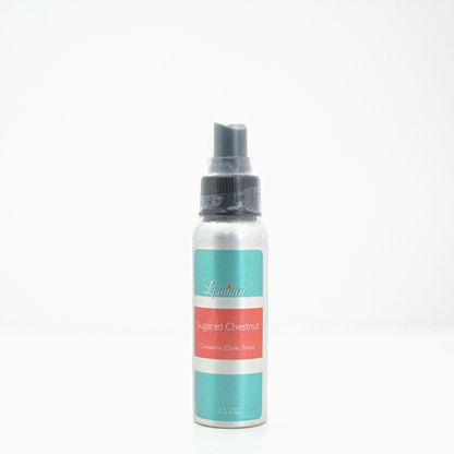 A 2.5oz Sugared Chestnut room & linen spray sitting against a white background made by Eternel Luminen.