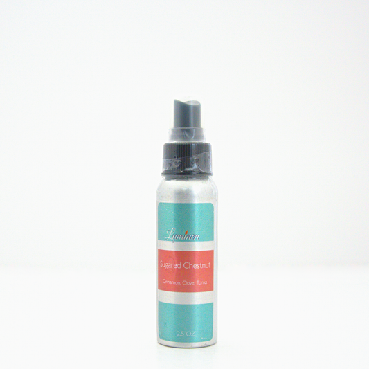 A 2.5oz Sugared Chestnut room & linen spray sitting against a white background made by Eternel Luminen.