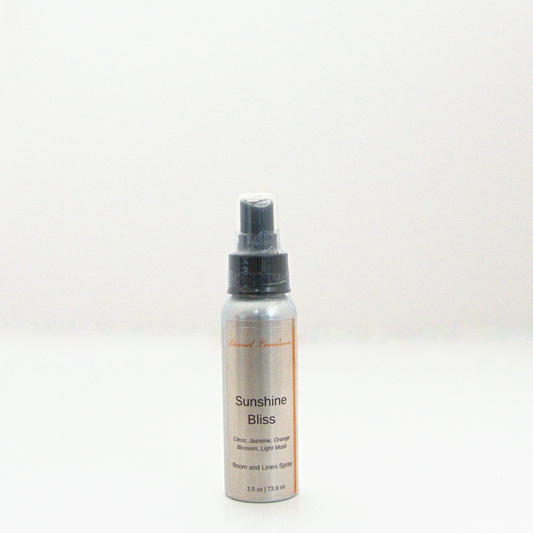A 2.5oz Sunshine Bliss room & linen spray sitting against a white background made by Eternel Luminen. 