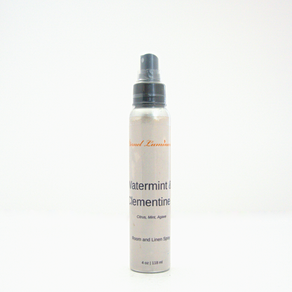 A 4oz Watermint & Clementine room & linen spray sitting against a white background made by Eternel Luminen.
