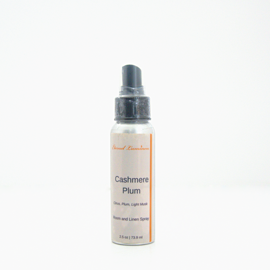 A 2.5oz Cashmere Plum room & linen spray sitting against a white background made by Eternel Luminen.
