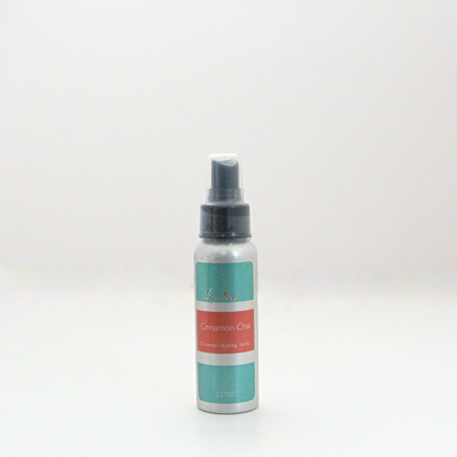 A 2.5oz Cinnamon Chai room & linen spray sitting against a white background made by Eternel Luminen. 