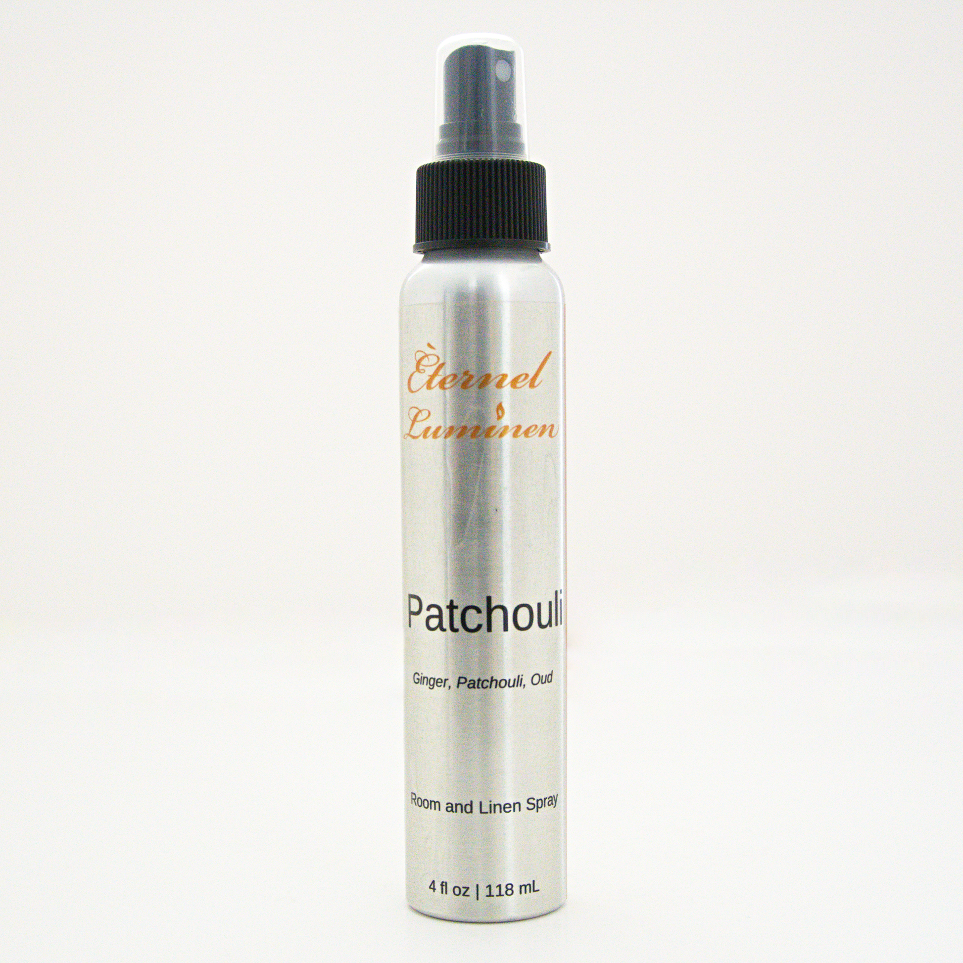 A 4oz Patchouli room & linen spray sitting against a white background made by Eternel Luminen. 